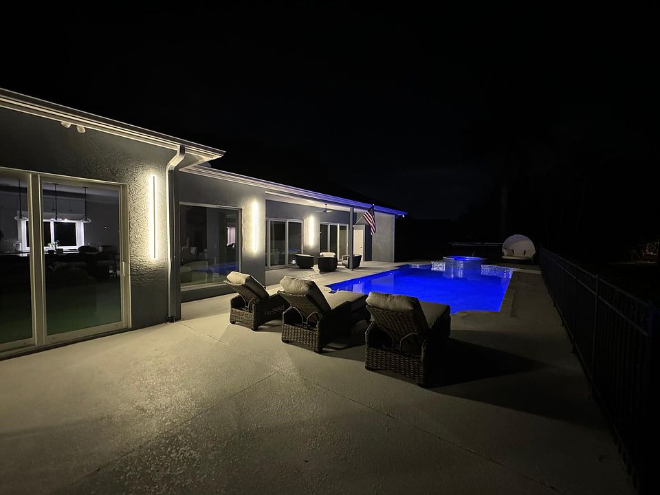 Nights by the pool with firepit, lounge chairs and sitting area