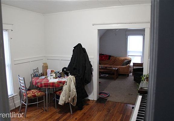 dining room Wood floor connecting the kitchen to one bedroom