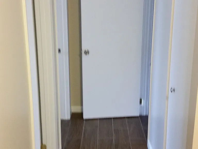 2nd Floor Hallway with Bedroom #2 and #2 on Left and Jack and Jill Bathroom Door at the end on the right