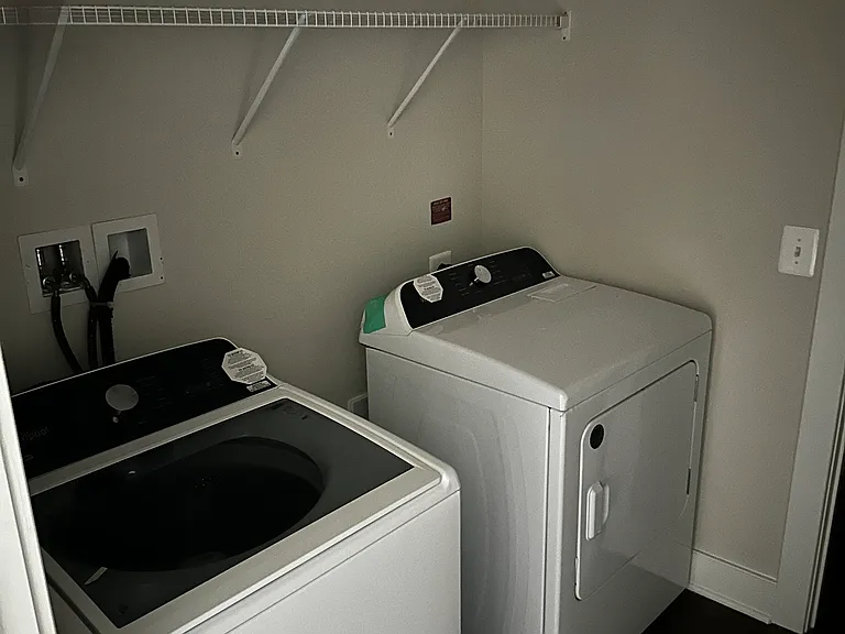 Laundry Room with Full Sized Washer and Dryer