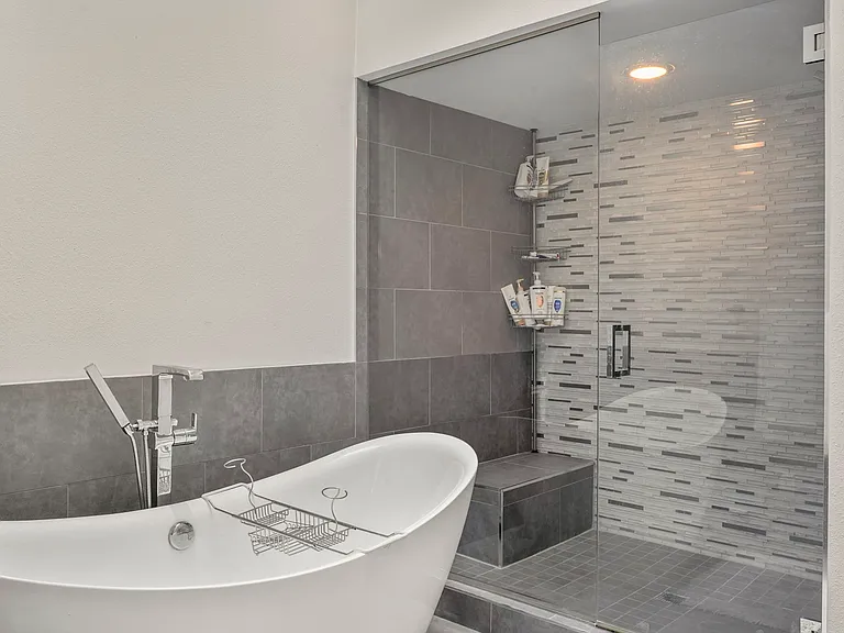 Master Bathroom with full standalone tub and walk-in shower