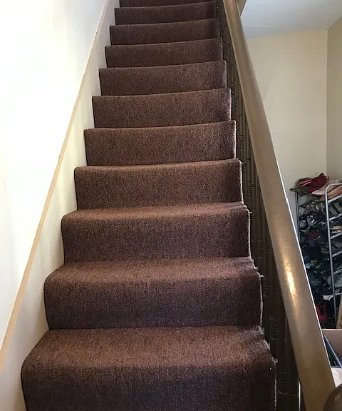 Front stairs and small landing on the right for additional storage.