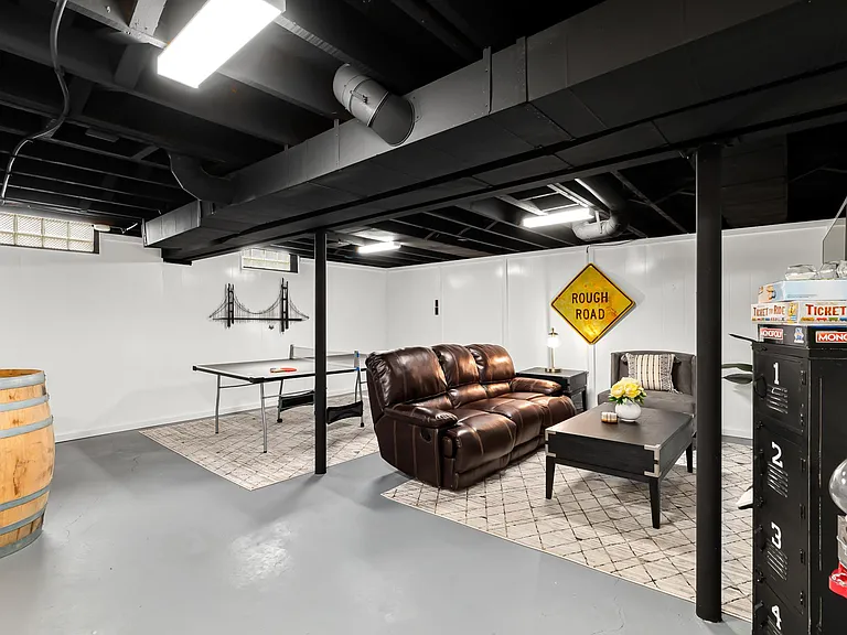 This spacious basement has plenty of space for games, relaxation, or just hanging out.