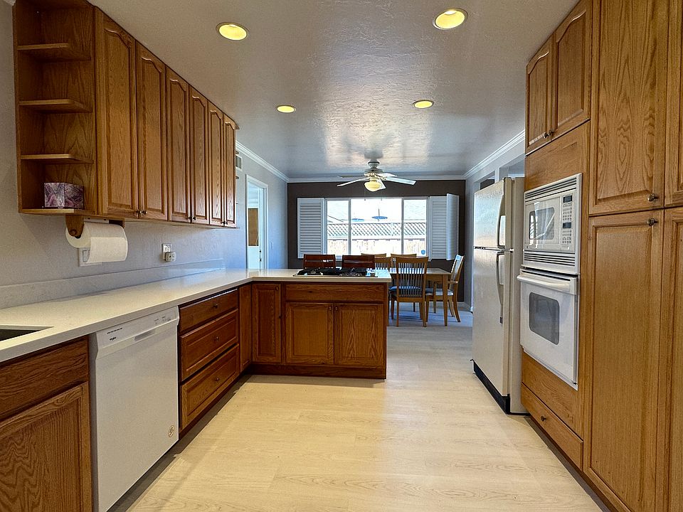 Newly renovated kitchen and dining room with recessed lighting in spring 2023