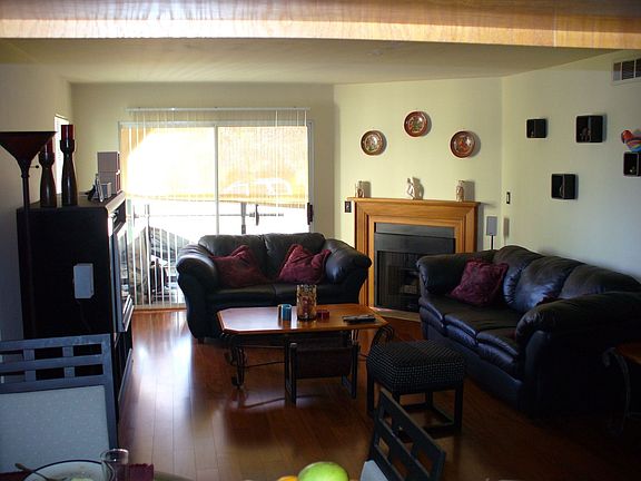 Sunny balcony, wood floors throughout, tiled kitchen/bathrooms