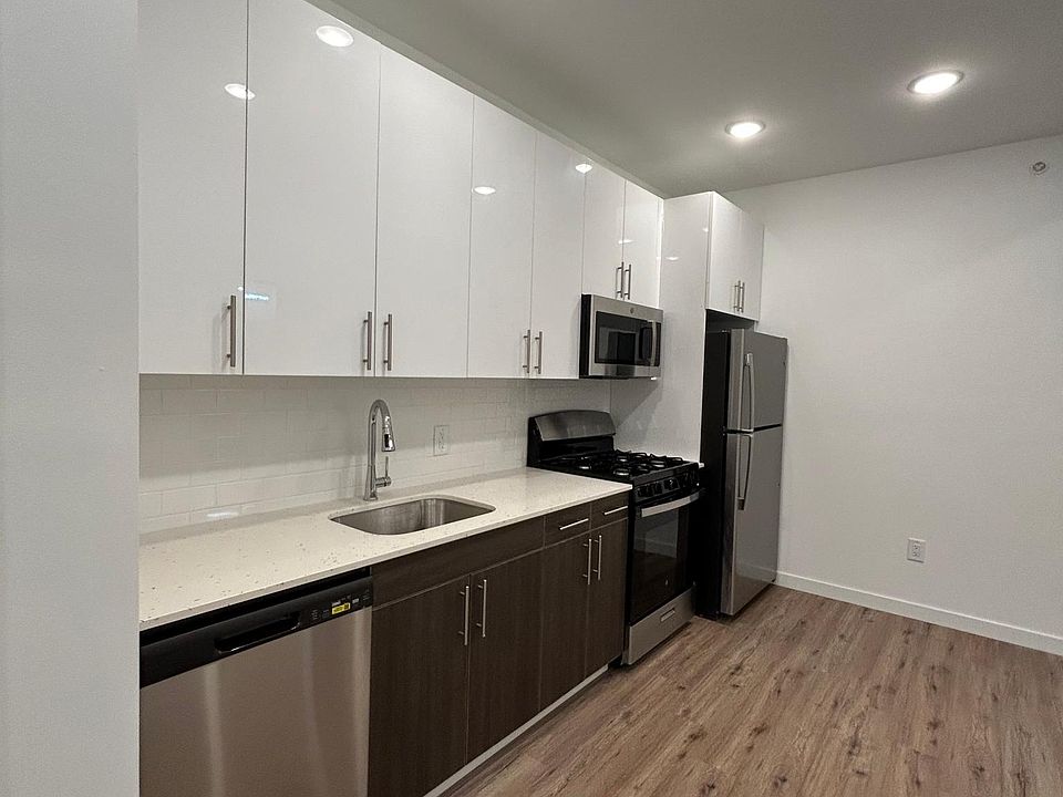 Beautifully remodeled kitchen with brand NEW stainless steel appliances .