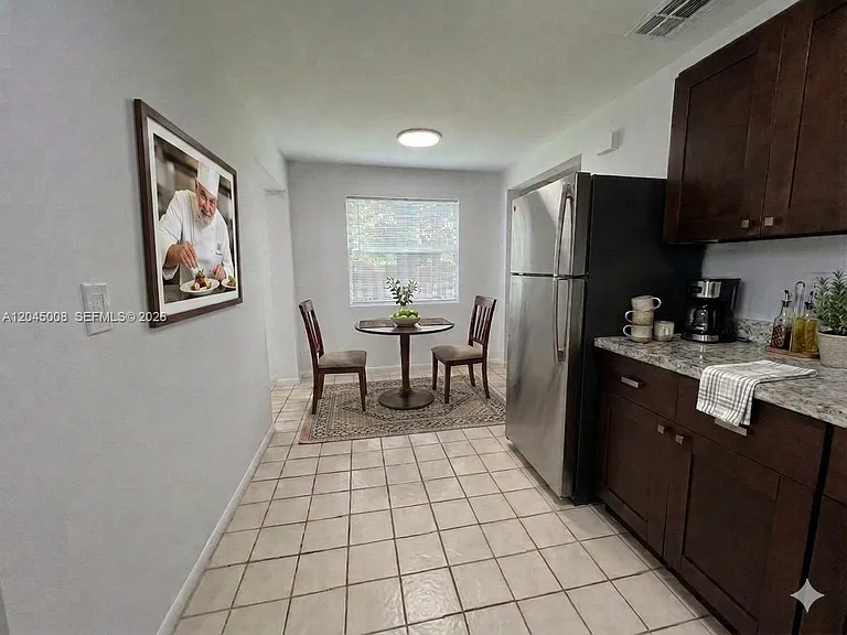 7720 Raleigh St — Photo 6