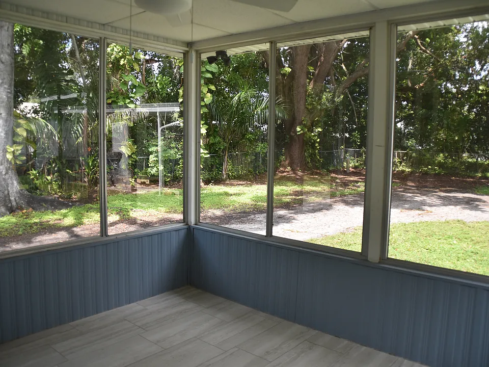 Outside enclosed lanai with ceiling fan and light, washer and dryer hook-ups on lanai.