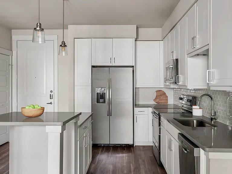 Open Kitchen with Stainless Steel Appliances and Ample Cabinetry