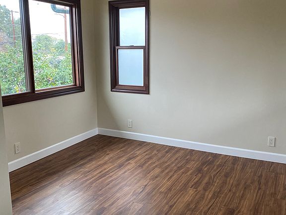Bedroom with in-unit AC and heat. Custom Elfa closet.