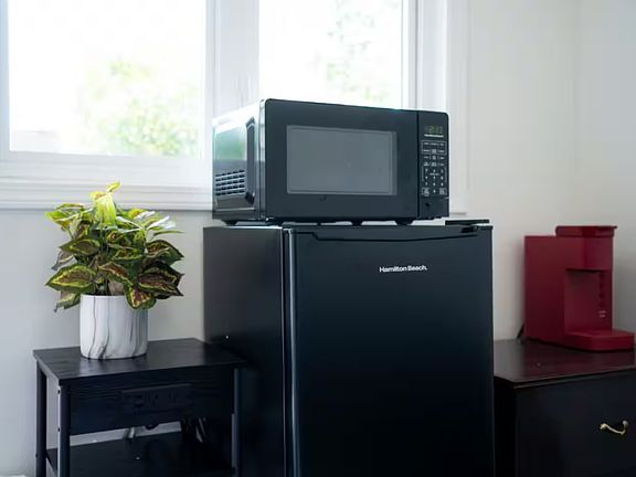 Microwave, Mini Fridge, and Keurig Coffee Machine.