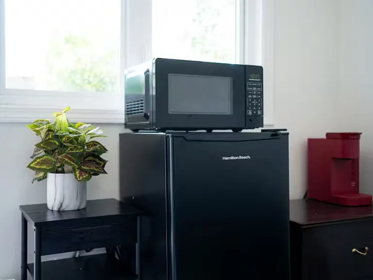 Microwave, Mini Fridge, and Keurig Coffee Machine.