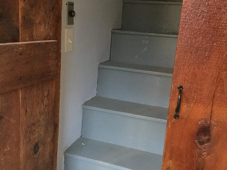 attic stairs, some storage, attic fan for cooling