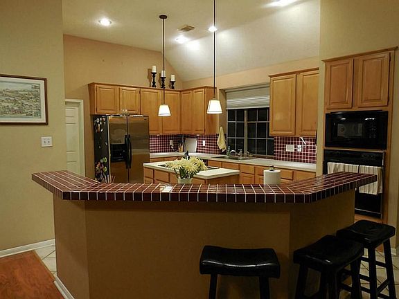The spacious island kitchen is very open to the breakfast area and the den / family room.