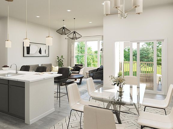 dining room with sliding door to covered deck