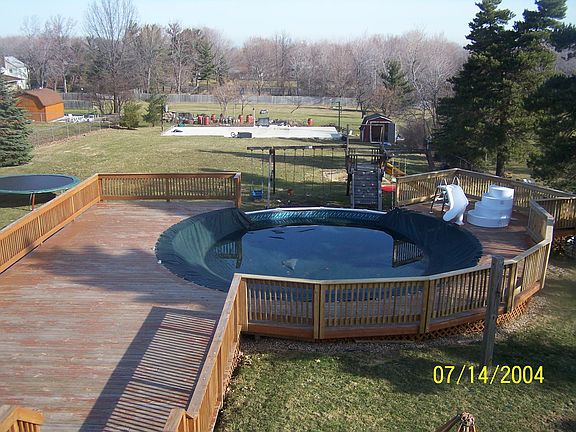 pool with wrap around deck before stain