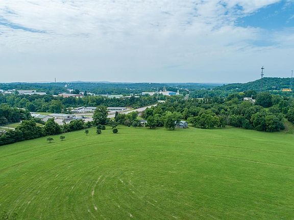Aerial facing toward the home and barn, note hwy 61/67