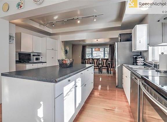 SUN DRENCHED SPACIOUS KITCHEN AND OVERSIZED KITCHEN ISLAND