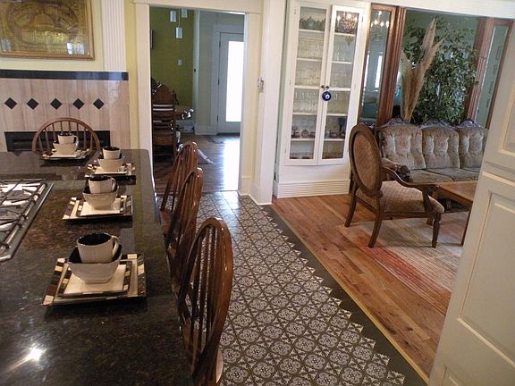 View of kitchen (tiled) with a peek into dining room