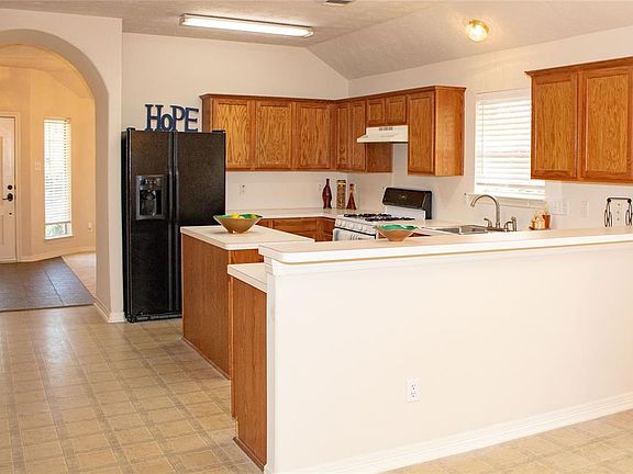 Large Kitchen with Island, Bar, and Breakfast Area