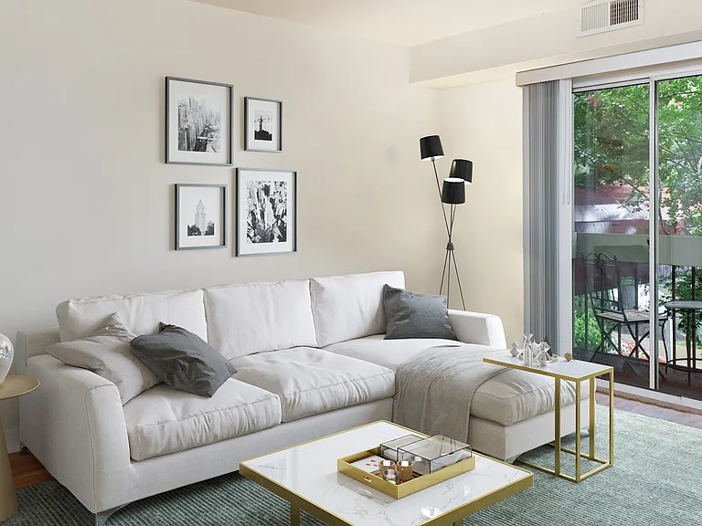 Living room includes private balcony access