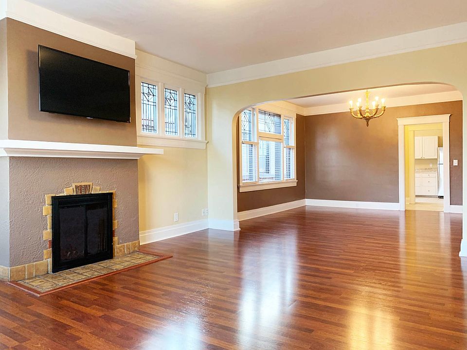 50 inch Flatscreen TV over Decorative Fireplace, Leaded Glass Windows