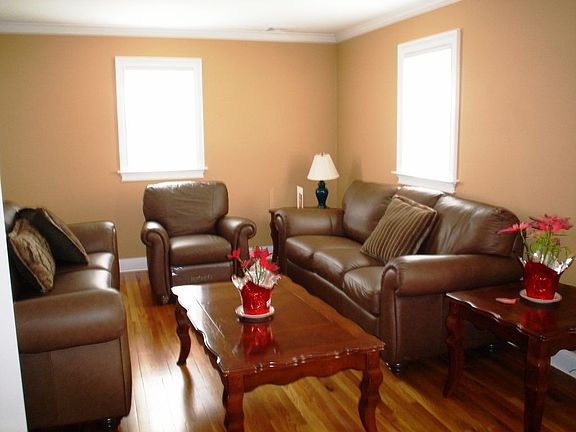 Living room with hardwood floors and ample storage
