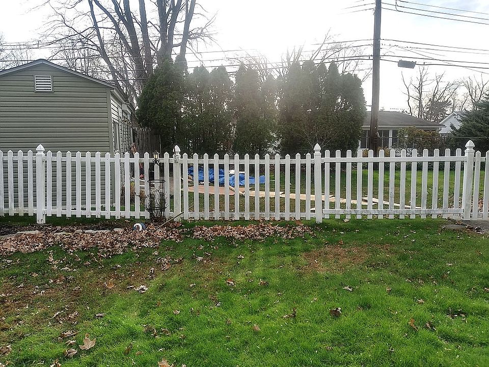 Side yard with 3 sheds