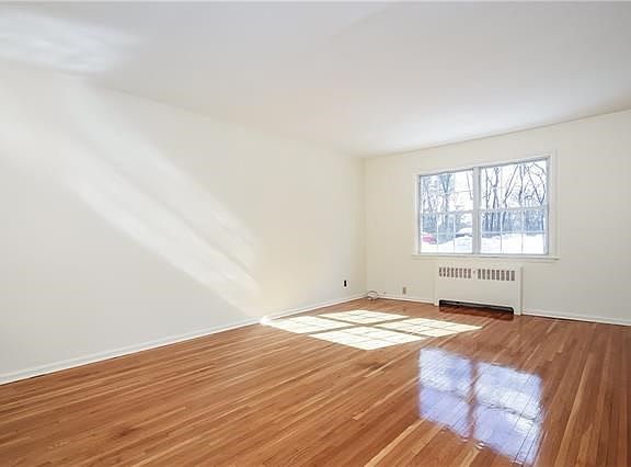 And, beyond the dining area is a large living room with double windows at both ends to let the sunshine in.
