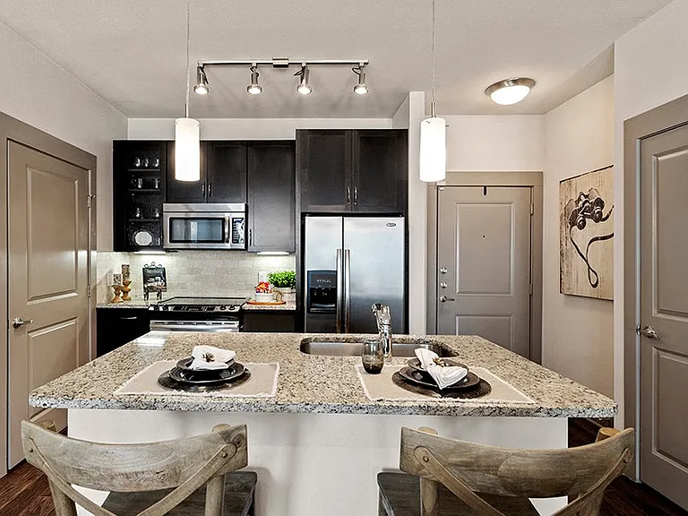 Granite or Quartz countertops with natural Travertine backsplash