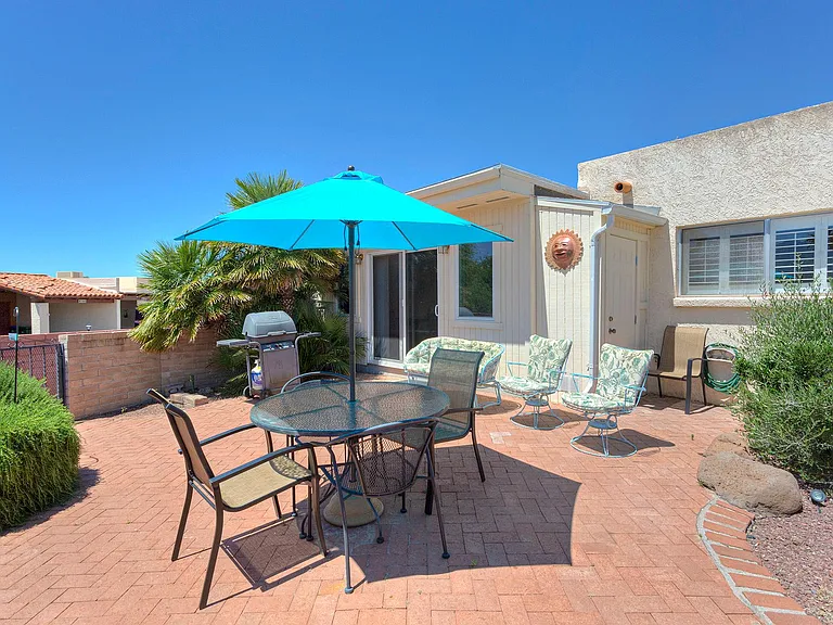 Private patio with gas grill.