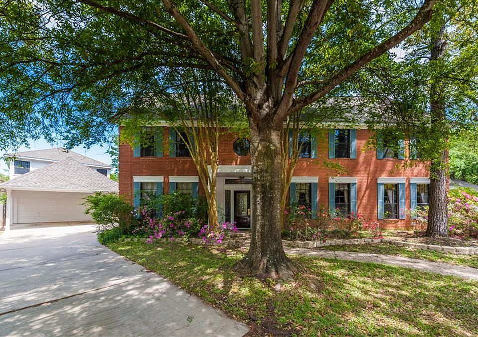Stunning curb appeal with numerous shade trees