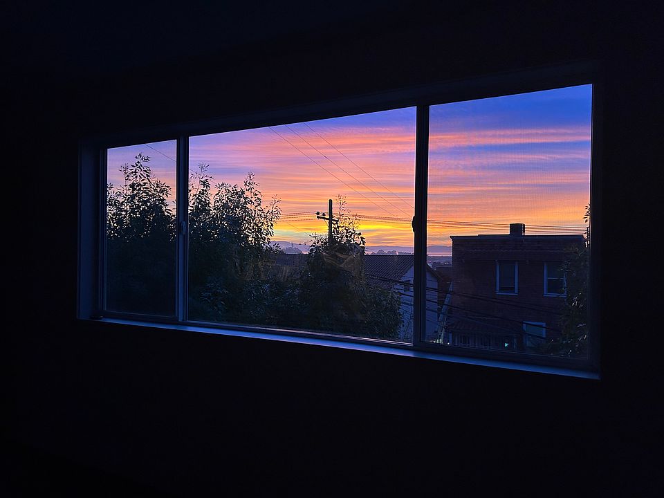 beautiful sunsets out the large picture window in living room