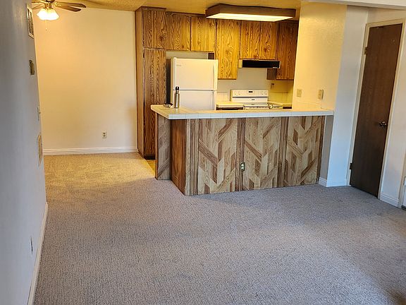 Open concept living room with kitchen and dinning room/office to the right