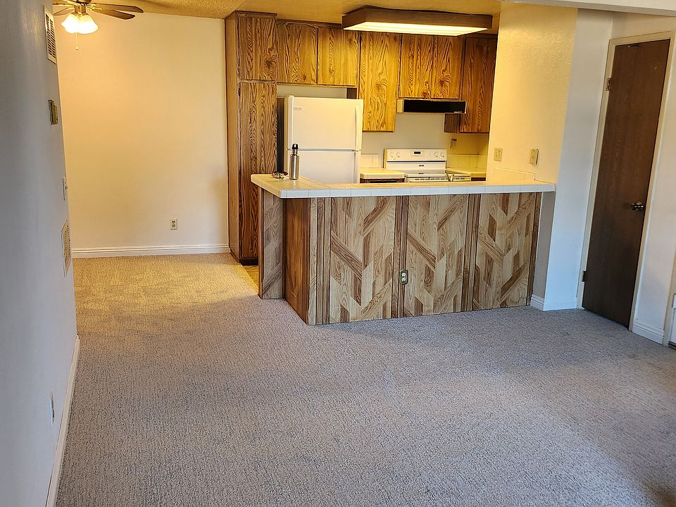 Open concept living room with kitchen and dinning room/office to the right