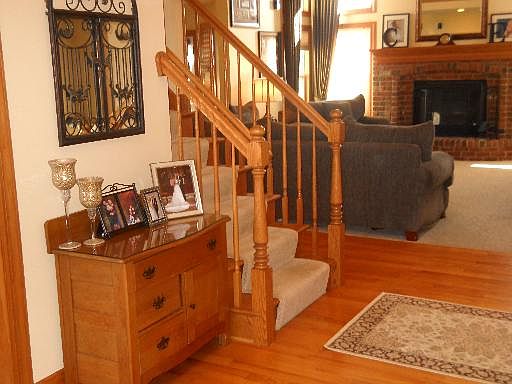 The warm and inviting entryway offers beautiful hardwood floors.