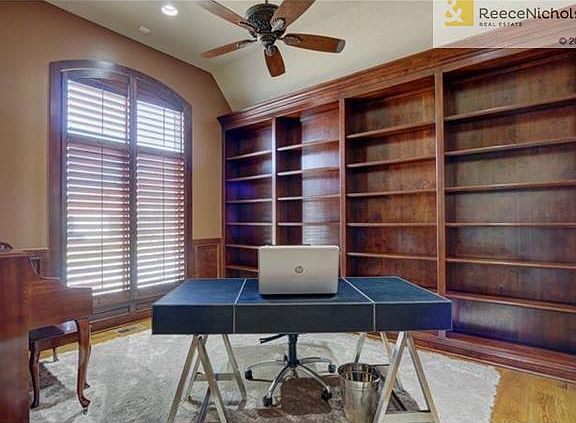 Main floor office w/ built ins and vaulted ceiings
