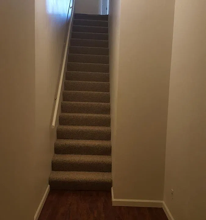 Front Entry Way and Stairs looking West