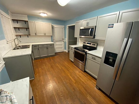 Updated kitchen with stainless steel appliances.