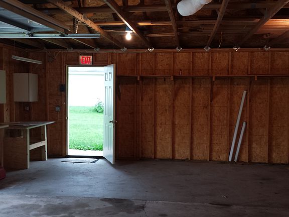 Inside of garage with plenty of shelves.