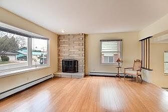 Gas fireplace, a beautiful picture window and hardwood floor