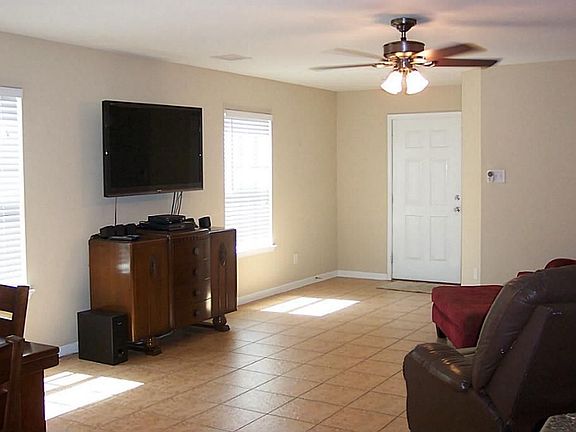 Spacious living or den area with tile flooring