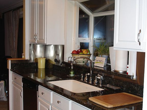 Updated cabinets, slab granite