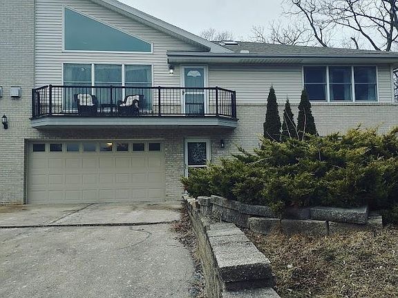 exterior of property with wide double driveway shared by both units
