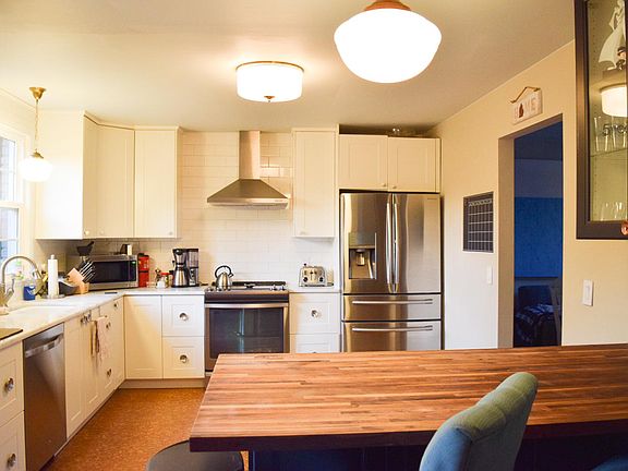 Open concept kitchen with marble counter tops