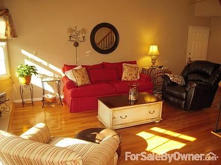 Living room
						:
						Bright natural light adds coziness to the spacious living area.