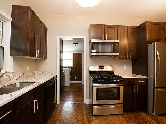 Modern, updated kitchen with stove, DW and fridge.
