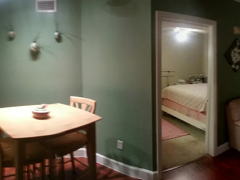 Dining nook with view into bedroom.