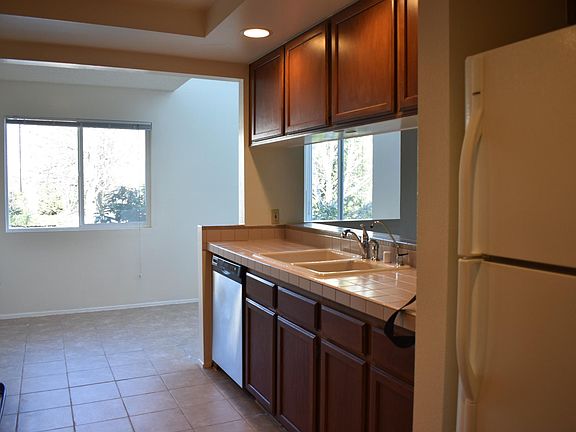 Bright kitchen and breakfast nook with Cascade Mountain view and skylight