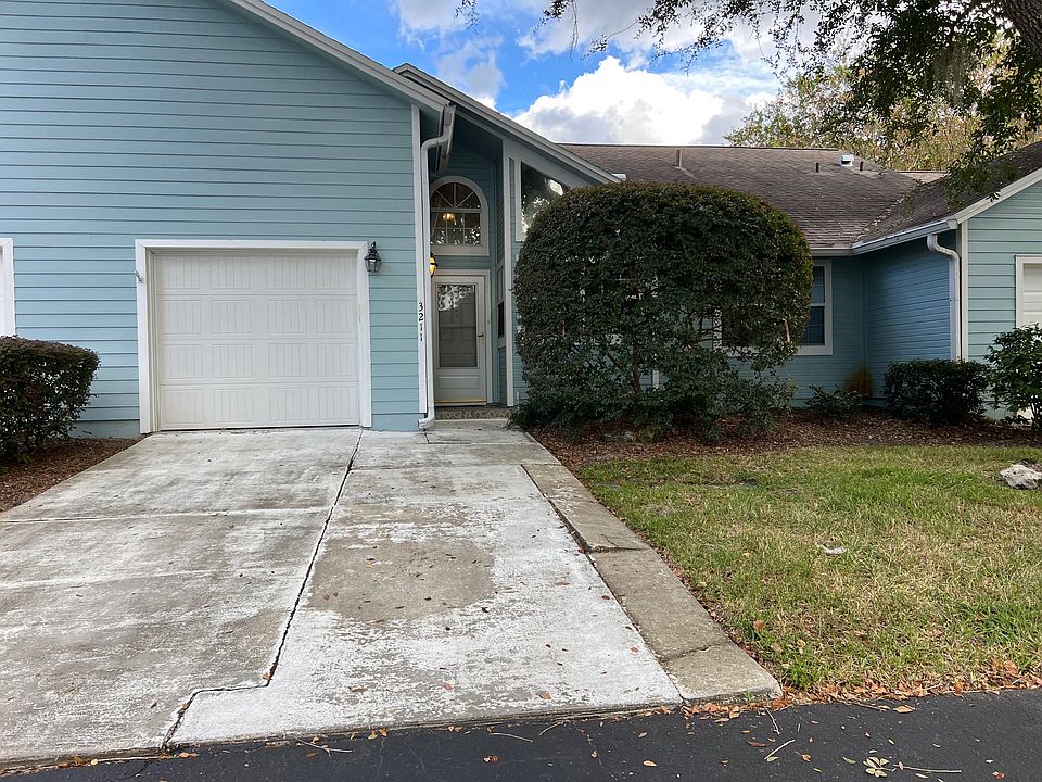 Outside front of home showing garage and front door.